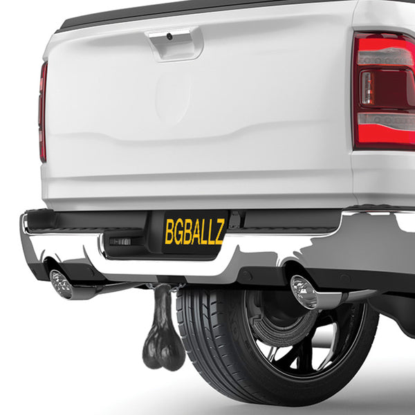 Black truck nuts novelty accessory for vehicle hitch, hanging automotive decoration.